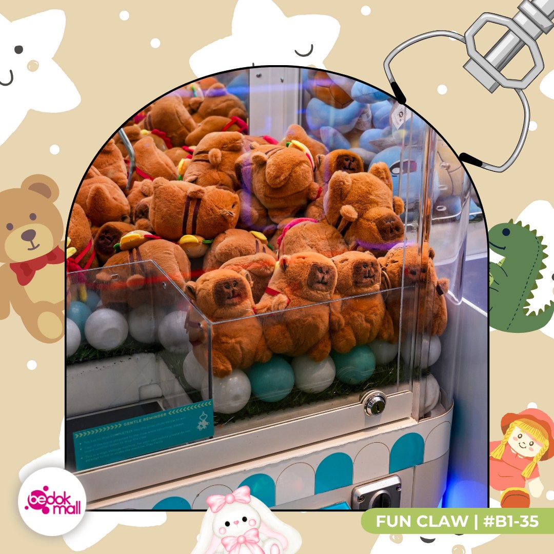 A delighted player proudly displaying a newly won plush toy from Fun Claw.